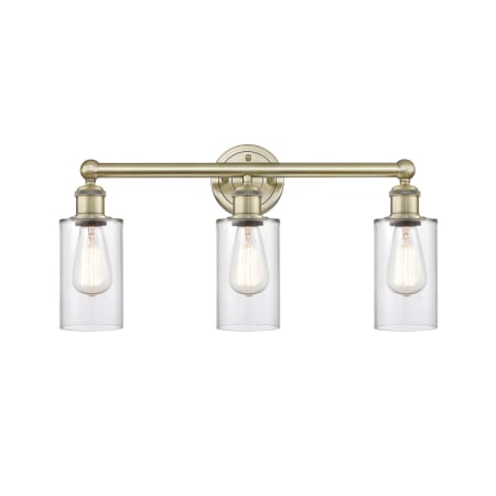 A large image of the Innovations Lighting 616-3W-12-22 Clymer Vanity Antique Brass / Clear