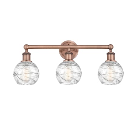 A large image of the Innovations Lighting 616-3W-11-24 Athens Vanity Antique Copper / Clear Deco Swirl