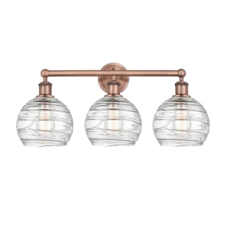 A large image of the Innovations Lighting 616-3W-13-26 Athens Vanity Antique Copper / Clear Deco Swirl