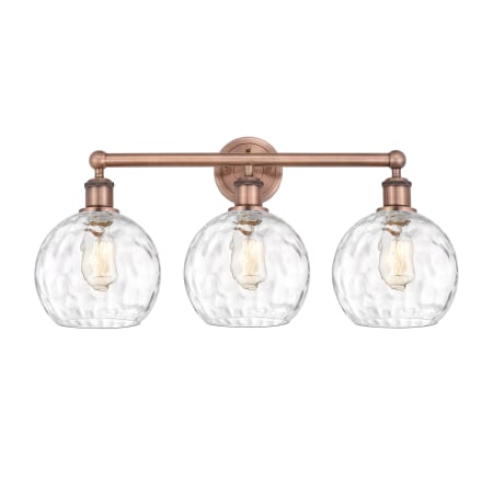 A large image of the Innovations Lighting 616-3W-13-26 Athens Vanity Antique Copper / Clear Water Glass