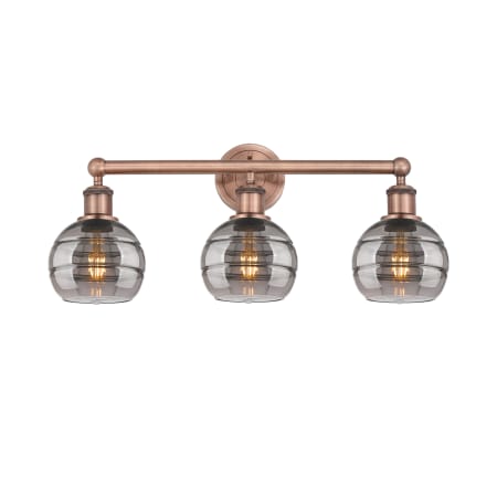 A large image of the Innovations Lighting 616-3W 10 24 Rochester Vanity Antique Copper / Light Smoke