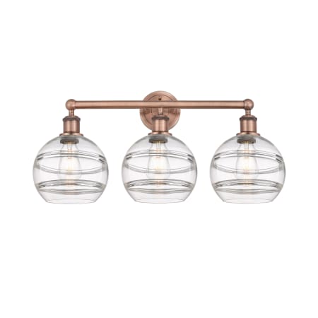 A large image of the Innovations Lighting 616-3W 12 26 Rochester Vanity Antique Copper / Clear