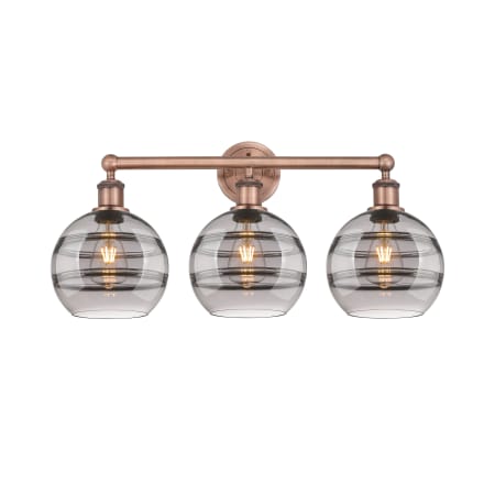 A large image of the Innovations Lighting 616-3W 12 26 Rochester Vanity Antique Copper / Light Smoke