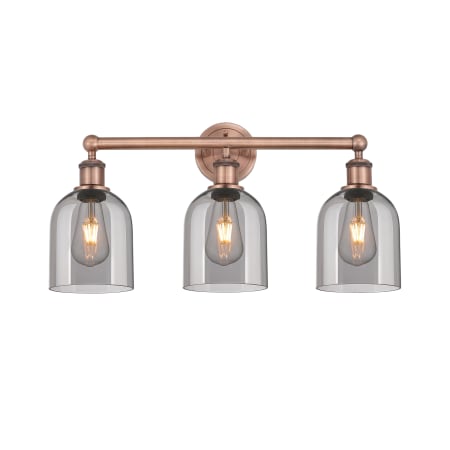 A large image of the Innovations Lighting 616-3W 12 24 Bella Vanity Antique Copper / Light Smoke