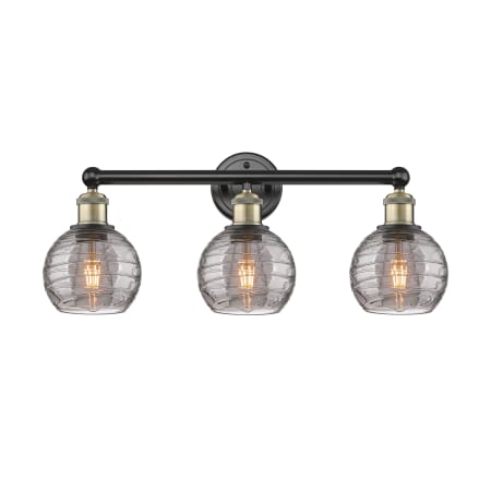 A large image of the Innovations Lighting 616-3W 10 24 Athens Deco Swirl Vanity Black Antique Brass / Light Smoke Deco Swirl