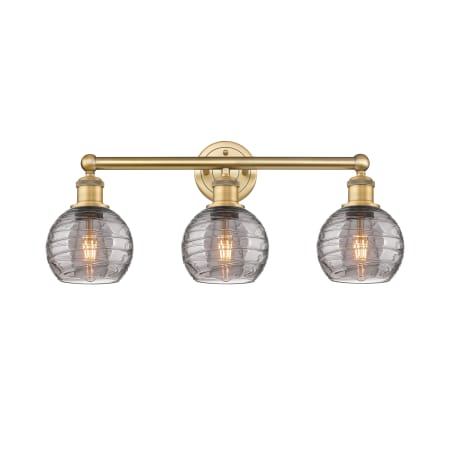 A large image of the Innovations Lighting 616-3W 10 24 Athens Deco Swirl Vanity Brushed Brass / Light Smoke Deco Swirl