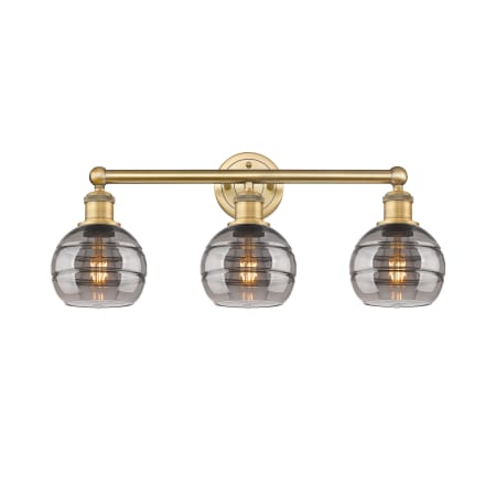 A large image of the Innovations Lighting 616-3W 10 24 Rochester Vanity Brushed Brass / Light Smoke