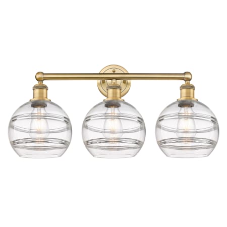 A large image of the Innovations Lighting 616-3W 12 26 Rochester Vanity Brushed Brass / Clear