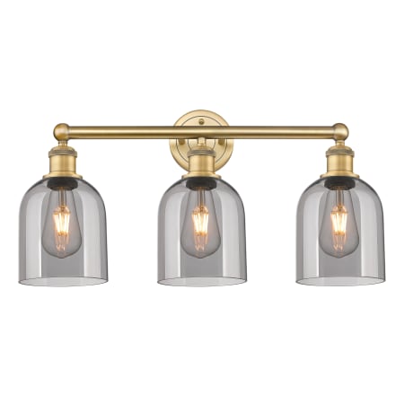 A large image of the Innovations Lighting 616-3W 12 24 Bella Vanity Brushed Brass / Light Smoke