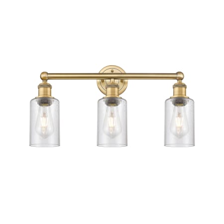 A large image of the Innovations Lighting 616-3W-11-22 Clymer Vanity Brushed Brass / Seedy