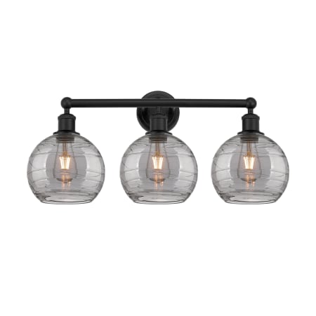 A large image of the Innovations Lighting 616-3W 12 26 Athens Deco Swirl Vanity Matte Black / Light Smoke Deco Swirl