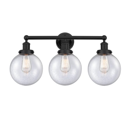 A large image of the Innovations Lighting 616-3W-10-25-L Beacon Vanity Matte Black / Seedy