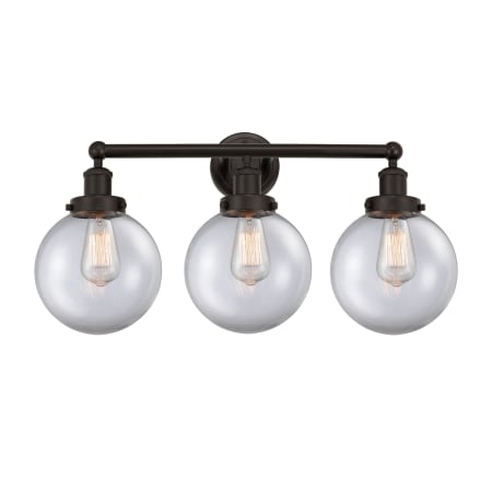 A large image of the Innovations Lighting 616-3W-10-25-L Beacon Vanity Oil Rubbed Bronze / Clear