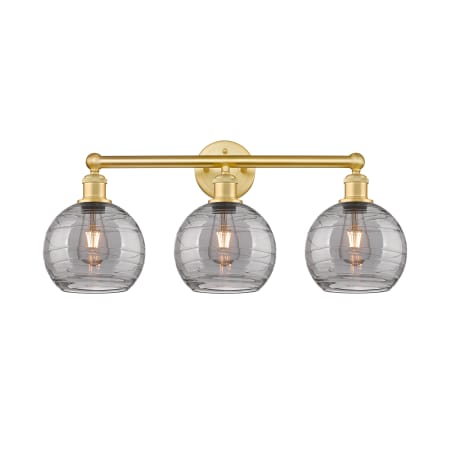 A large image of the Innovations Lighting 616-3W 12 26 Athens Deco Swirl Vanity Satin Gold / Light Smoke Deco Swirl