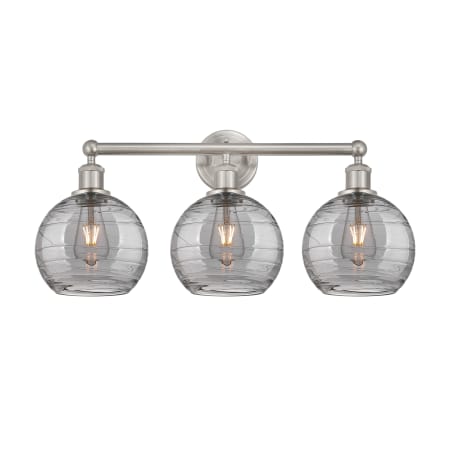 A large image of the Innovations Lighting 616-3W 12 26 Athens Deco Swirl Vanity Satin Nickel / Light Smoke Deco Swirl