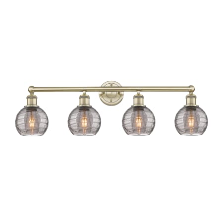 A large image of the Innovations Lighting 616-4W 10 33 Athens Deco Swirl Vanity Antique Brass / Light Smoke Deco Swirl