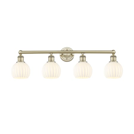 A large image of the Innovations Lighting 616-4W 10 33 White Venetian Vanity Antique Brass