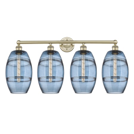 A large image of the Innovations Lighting 616-4W-12-35 Vaz Vanity Antique Brass / Blue