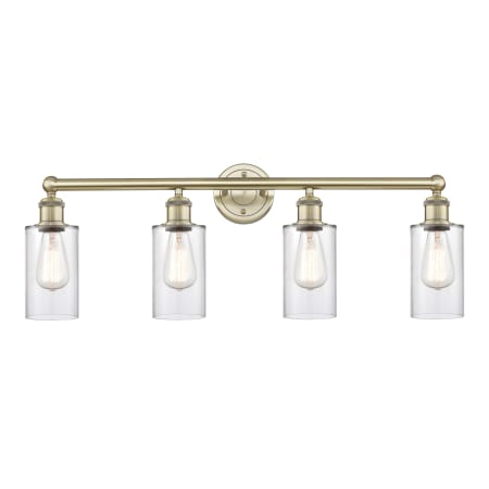 A large image of the Innovations Lighting 616-4W-12-31 Clymer Vanity Antique Brass / Clear