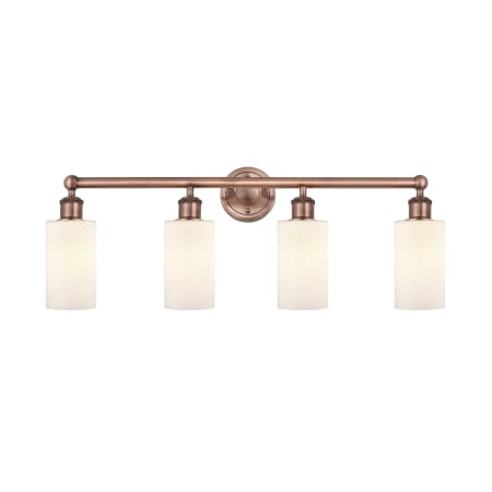 A large image of the Innovations Lighting 616-4W-12-31 Clymer Vanity Antique Copper / Matte White