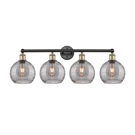 A large image of the Innovations Lighting 616-4W 12 35 Athens Deco Swirl Vanity Black Antique Brass / Light Smoke Deco Swirl