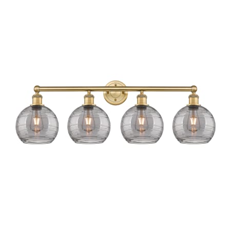 A large image of the Innovations Lighting 616-4W 12 35 Athens Deco Swirl Vanity Brushed Brass / Light Smoke Deco Swirl