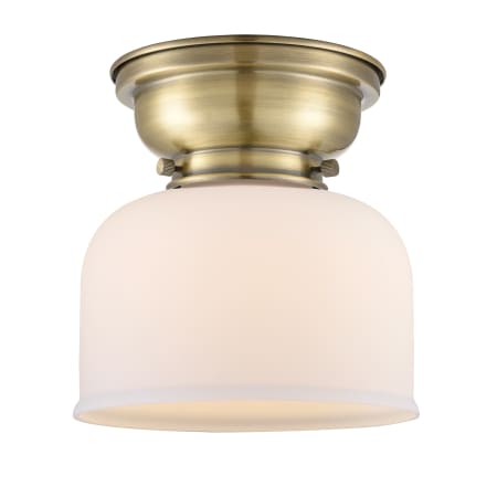 A large image of the Innovations Lighting 623-1F Large Bell Antique Brass / Matte White