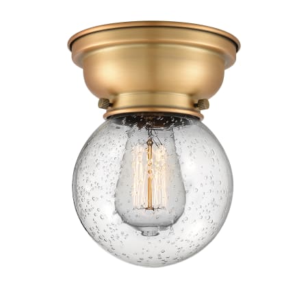 A large image of the Innovations Lighting 623-1F-7-6 Beacon Semi-Flush Brushed Brass / Seedy