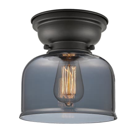 A large image of the Innovations Lighting 623-1F Large Bell Matte Black / Plated Smoke