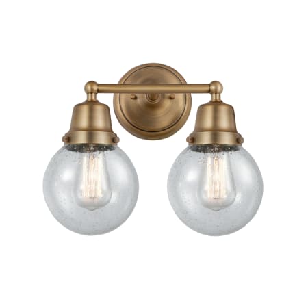 A large image of the Innovations Lighting 623-2W-12-14 Beacon Vanity Brushed Brass / Seedy