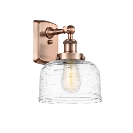 A large image of the Innovations Lighting 916-1W-13-8 Bell Sconce Antique Copper / Clear Deco Swirl