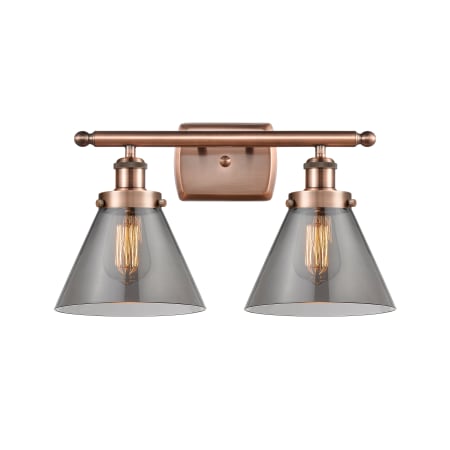 A large image of the Innovations Lighting 916-2W-13-18 Cone Vanity Antique Copper / Plated Smoke