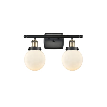 A large image of the Innovations Lighting 916-2W-11-16 Beacon Vanity Black Antique Brass / Matte White