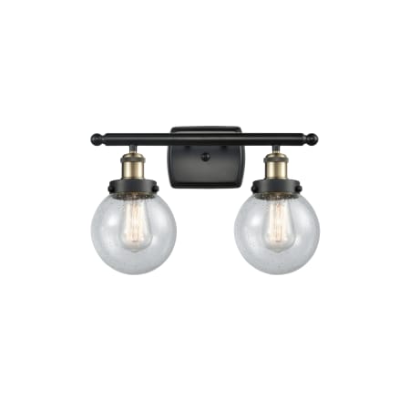 A large image of the Innovations Lighting 916-2W-11-16 Beacon Vanity Black Antique Brass / Seedy