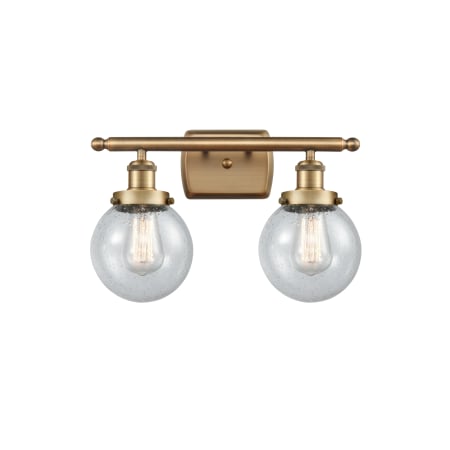 A large image of the Innovations Lighting 916-2W-11-16 Beacon Vanity Brushed Brass / Seedy