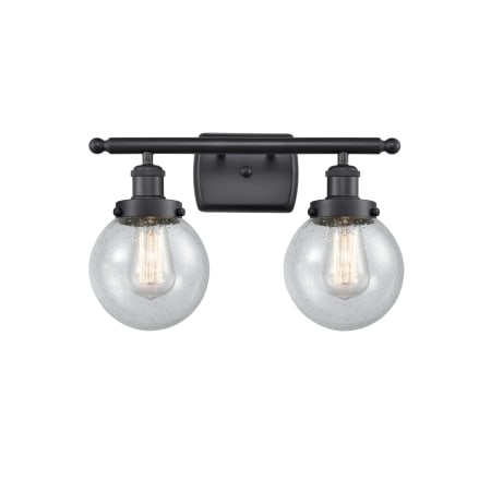A large image of the Innovations Lighting 916-2W Beacon Matte Black / Seedy