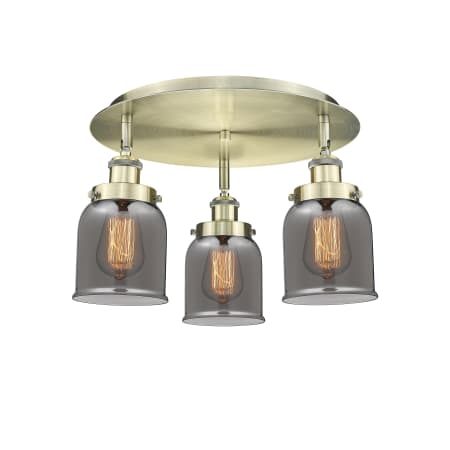 A large image of the Innovations Lighting 916-3C-10-17 Bell Flush Antique Brass / Plated Smoke