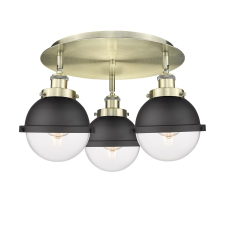 A large image of the Innovations Lighting 916-3C-11-19 Ballston Urban Flush Antique Brass / Matte Black / Clear