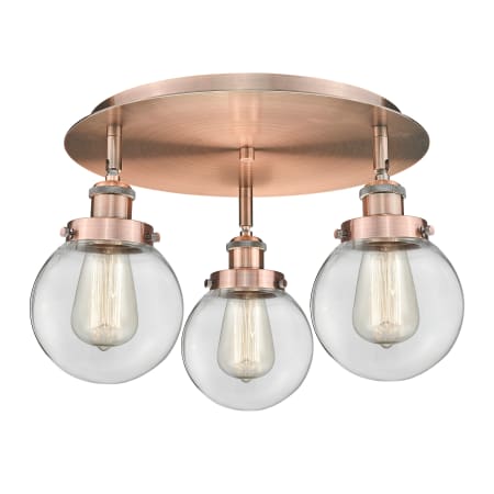 A large image of the Innovations Lighting 916-3C-10-18 Beacon Flush Antique Copper / Clear