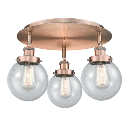 A large image of the Innovations Lighting 916-3C-10-18 Beacon Flush Antique Copper / Seedy
