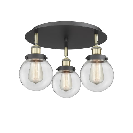 A large image of the Innovations Lighting 916-3C-10-18 Beacon Flush Black Antique Brass / Clear