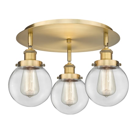 A large image of the Innovations Lighting 916-3C-10-18 Beacon Flush Brushed Brass / Clear