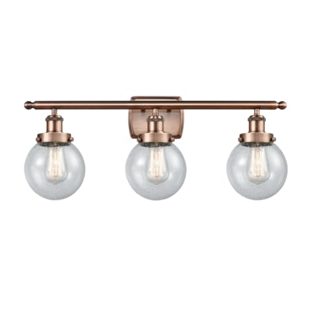 A large image of the Innovations Lighting 916-3W-11-26 Beacon Vanity Antique Copper / Seedy