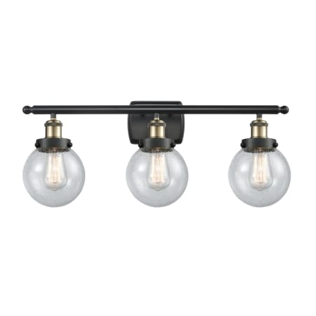 A large image of the Innovations Lighting 916-3W-11-26 Beacon Vanity Black Antique Brass / Seedy