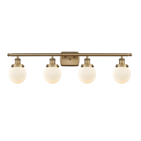 A large image of the Innovations Lighting 916-4W-11-36 Beacon Vanity Brushed Brass / Matte White