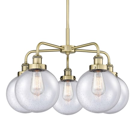 A large image of the Innovations Lighting 916-5CR-18-26 Beacon Chandelier Antique Brass / Seedy