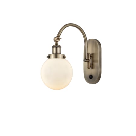 A large image of the Innovations Lighting 918-1W-13-6 Beacon Sconce Antique Brass / Matte White