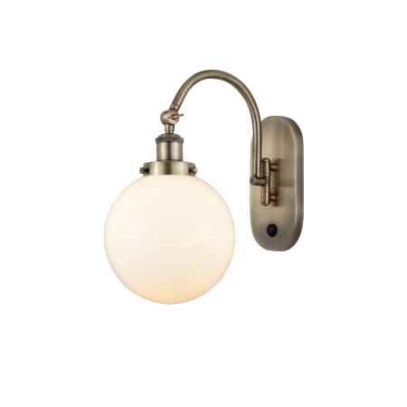 A large image of the Innovations Lighting 918-1W-15-8 Beacon Sconce Antique Brass / Matte White
