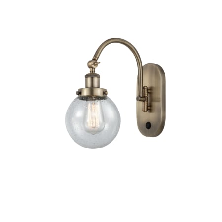 A large image of the Innovations Lighting 918-1W-13-6 Beacon Sconce Antique Brass / Seedy