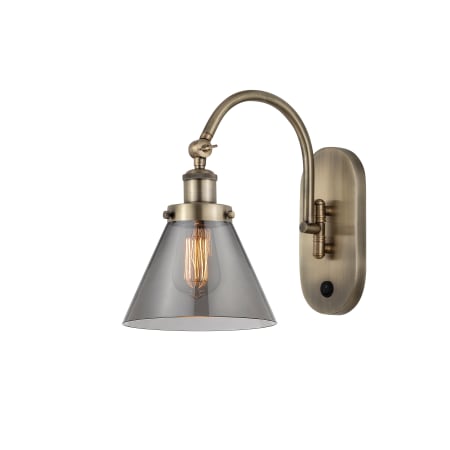 A large image of the Innovations Lighting 918-1W-13-8 Cone Sconce Antique Brass / Plated Smoke